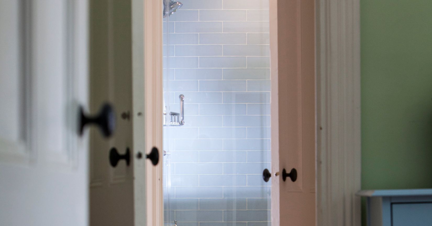 Entrance to bathroom with view of walk-in shower